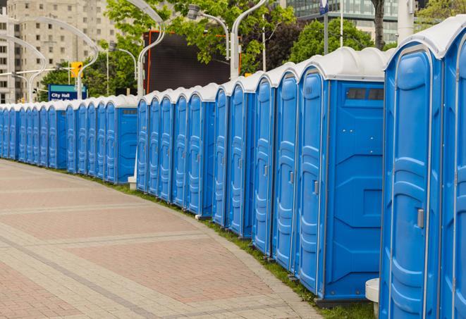 a row of sleek and modern portable restrooms at a special outdoor event in Deerfield