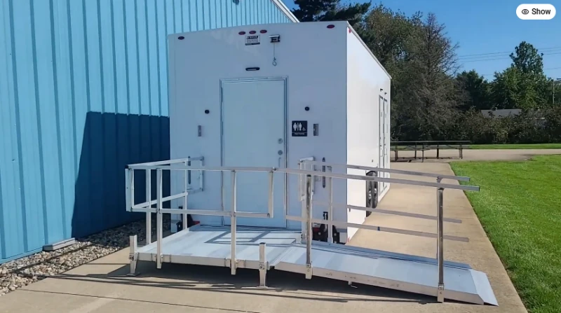 ADA-accessible portable restroom with a ramp, available for rent in Rochester, NY