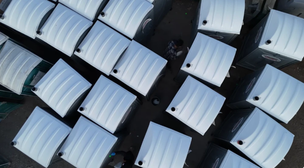 Aerial view of white portable restroom units staged for rental in Rochester, NY