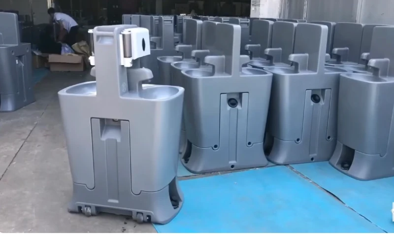 Portable hand washing station with a row of units behind it